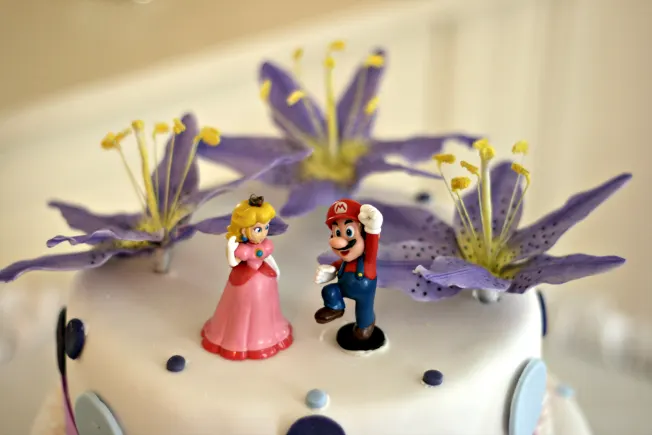 Two wedding cake topper figures